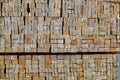 Stacked wooden bars fence on a lumber yard. Building materials Royalty Free Stock Photo