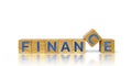 Stacked wooden cubes with finance text on separate wooden cubes Royalty Free Stock Photo