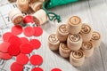 Stacked wooden lotto barrels, game cards and red chops for a game in lotto Royalty Free Stock Photo