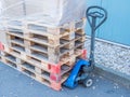 Stacked wooden pallets logistic with lift truck Royalty Free Stock Photo