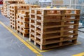 Stacked wooden pallets at a storage