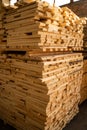 Stacked wooden planks. Hardware store or construction site. Wood for house construction. Building material. Wood Royalty Free Stock Photo