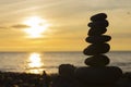 Stacked Zen Stones and Sunset Silhouette Royalty Free Stock Photo