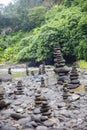 Stacked zen stones at Tegenungan Waterfall at Bali, Indonesia Royalty Free Stock Photo