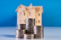 A stacking coins and house model Royalty Free Stock Photo