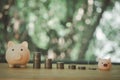 Stacking coins pile and cute pink piggy bank for savings money Royalty Free Stock Photo