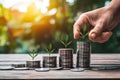 Stacking coins on wooden table, growth graph, finance concept