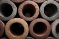 Stacking industrial pipes creating an abstract pattern with rough textures Royalty Free Stock Photo