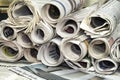 A stackof rolled newspapers