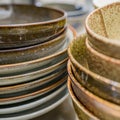 Stacks of Japanese bowls and plates in kitchen drawer. Royalty Free Stock Photo