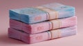 Stacks of banknotes with denominations of 100 and 500, in pink and light blue colors Royalty Free Stock Photo