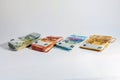 Stacks of banknotes, value of five, ten, twenty and fifty euro on a light gray background, concept for currency, business, finance Royalty Free Stock Photo