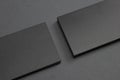 2 stacks of black blank textured business cards on dark paper background, us size 3.5 x 2 inches, as template for design Royalty Free Stock Photo