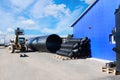 Stacks of black pvc plastic pipe outdoors with selective focus Royalty Free Stock Photo