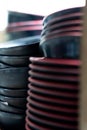 Stacks of black and red ceramic plates in a kitchen storage area, blurred background focus Royalty Free Stock Photo
