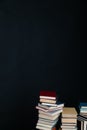 stacks of books scientific literature knowledge in the library on a black background Royalty Free Stock Photo