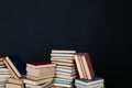 stacks of books scientific literature knowledge in the library on a black background Royalty Free Stock Photo