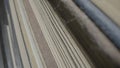 Stacks of books in shabby gray covers in the library. Rows of old books. Macro shot of old paper yellowed book pages