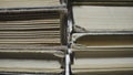 Stacks of books in shabby gray covers lying on table in the library. Rows of old books. Literature. Textbooks for Royalty Free Stock Photo