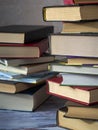 Stacks of books are on the table. Background with books for libraries, education, science