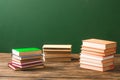 Stacks of books on wooden surface