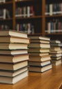 Stacks of Books on Wooden Table in Library Royalty Free Stock Photo
