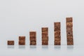 Stacks of brown sugar cubes on grey background