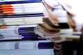 Stacks of business magazines on the desk Choose a shallow depth of field focus.