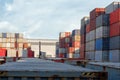 Stacks of cargo containers, import export ships in port harbour, industrial cargo shipping, container logistics, maritime Royalty Free Stock Photo