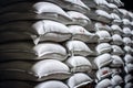 Stacks of cement bags stored in warehouse
