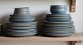 Stacks of ceramic dinnerware in shades Royalty Free Stock Photo