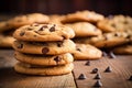 Stacks of chocolate chip cookies on the table, close up. Homemade pastries. AI generated