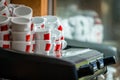 Stacks of coffee cups on coffee machine Royalty Free Stock Photo