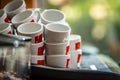 Stacks of coffee cups on coffee machine Royalty Free Stock Photo