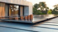 Stacks of coins are balanced on top of a solar panel installed on a flat roof. The coins glisten in the sunset