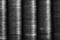 Stacks of coins closeup. Coin texture. Black and white business background. Wallpaper made of many coin edges. Economy finance and