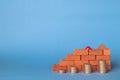 Stacks of coins in the form of steps against a background of blocks of red bricks. Royalty Free Stock Photo