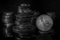 Stacks of Coins One Dollar Coin Blurred Background Dramatic Light Black and White Macro Royalty Free Stock Photo