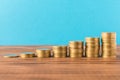 Stacks of coins on a wooden table. Business concept and growth of capital Royalty Free Stock Photo