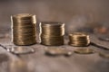 Stacks of coins on wooden tabletop