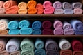 stacks of colored terry towels in a boutique