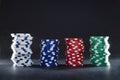 Stacks of colorful casino chips with black isolated background Royalty Free Stock Photo