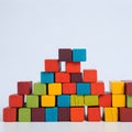 Stacks of colorful wooden blocks on a white background