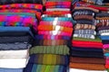 Stacks of Colorful Woven Textiles at the Traditional Market of Chinchero, Cuzco, Peru