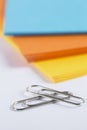 Stacks of coloured paper on a white table Royalty Free Stock Photo