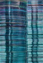Stacks of translucent blue CD and DVD data storage disks Royalty Free Stock Photo