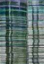 Data storage abstract background showing layered stacks of translucent metallic DVD and CD computer storage disks Royalty Free Stock Photo