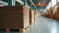 Stacks of corrugated cardboard sheets on pallets in a warehouse. Industrial interior with boxes and packaging materials. Raw Royalty Free Stock Photo