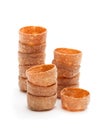 Stacks of croustades crispy pastry cases isolated on white