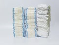 Stacks of diapers on white background. Royalty Free Stock Photo